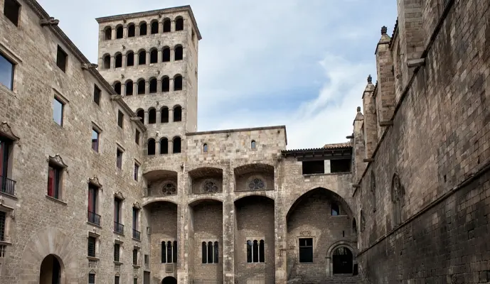 A large stone building with a solid structure and classic architectural features.