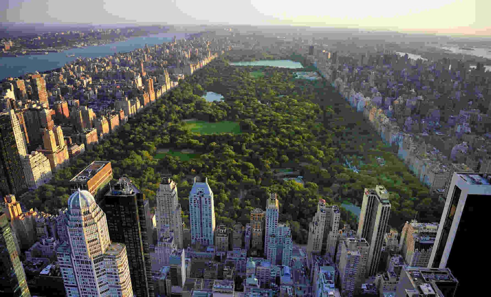 Aerial view of Central Park surrounded by skyscrapers in New York City.