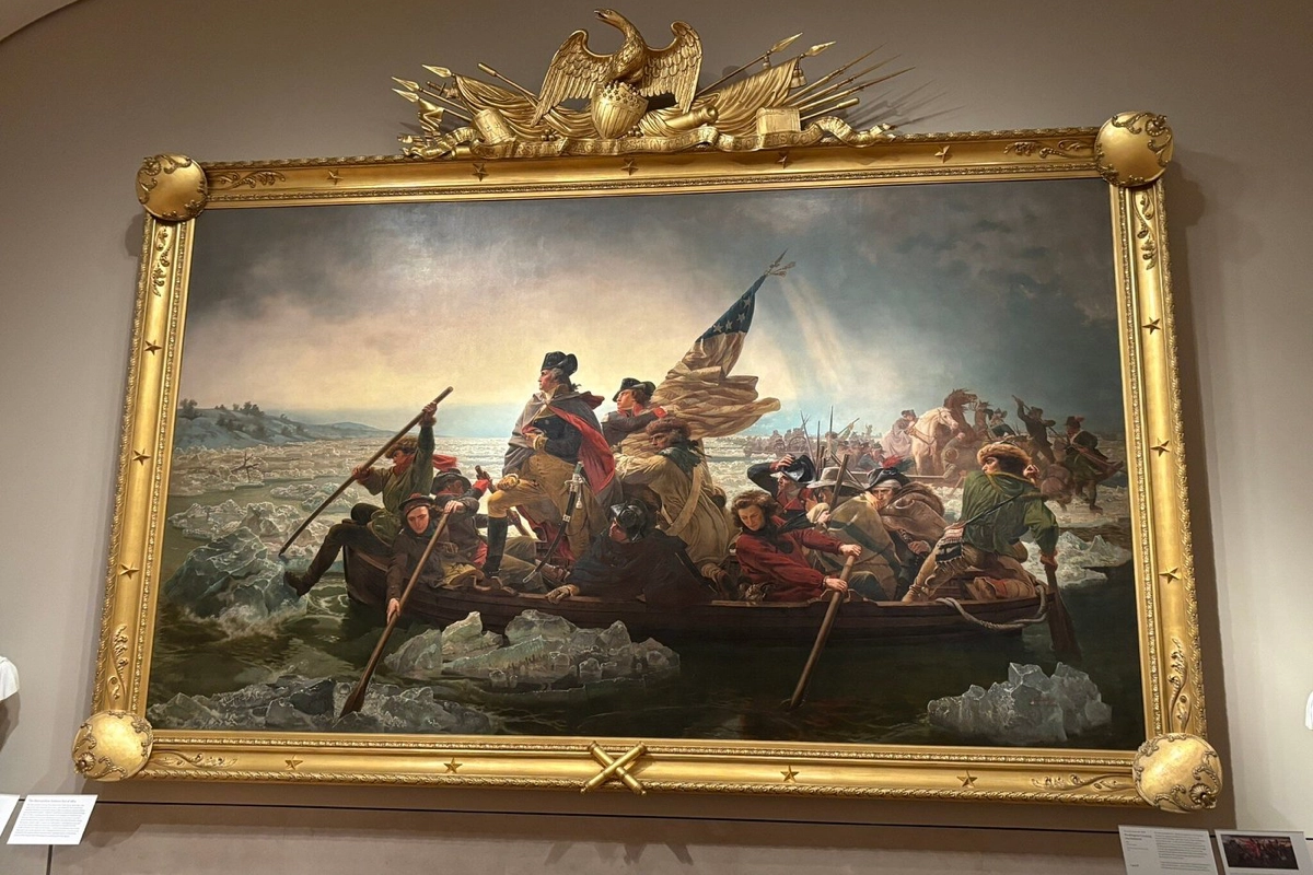 Luetze's Washington Crossing the Delaware displayed on a white wall in the NYC Met.