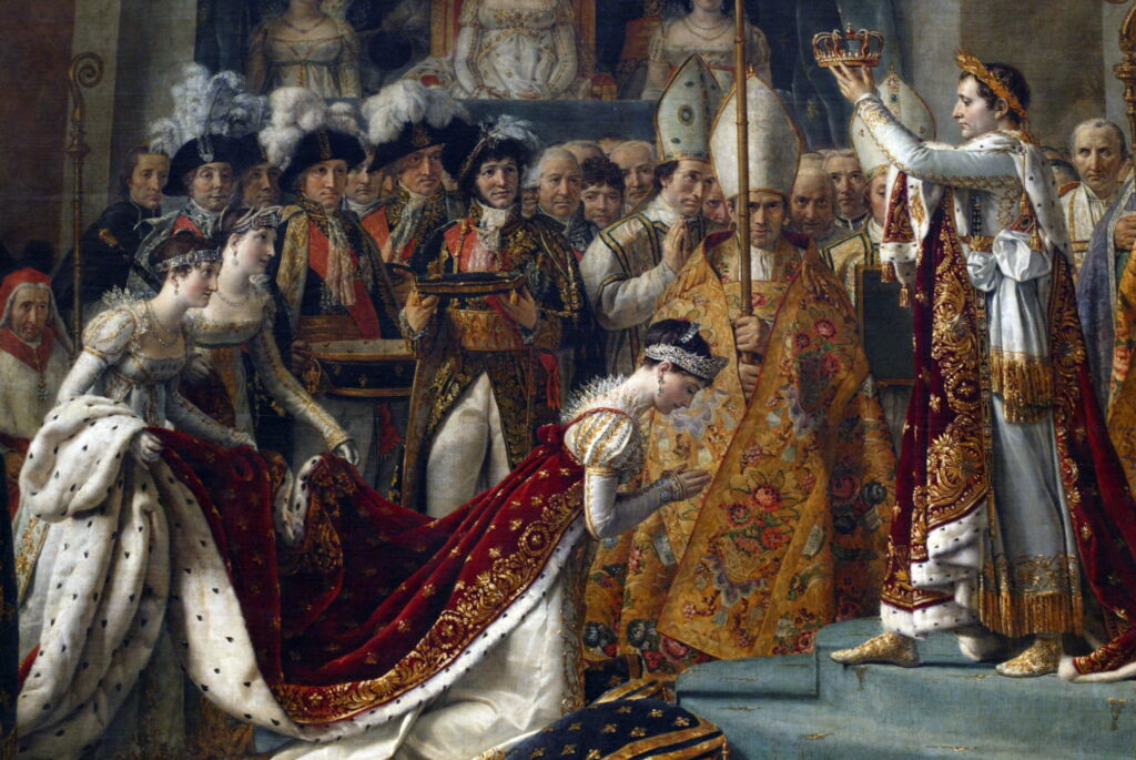 A grand historical painting depicting a coronation scene with an emperor placing a crown on a kneeling empress, surrounded by clergy, military officers, and courtiers. Richly adorned robes, elaborate decor, and expressions of reverence are present.